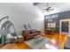 Open-concept living room features vaulted ceilings, modern lighting, and wood floors at 489 Meadowood Blvd, Fern Park, FL 32730