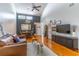Spacious living room with vaulted ceilings, wood floors, and abundant natural light at 489 Meadowood Blvd, Fern Park, FL 32730