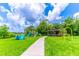 A playground with colorful slides and swings, along with a covered picnic area for families to enjoy at 489 Meadowood Blvd, Fern Park, FL 32730