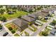 Aerial view of homes with manicured lawns, garages, fenced yards, and neighborhood playground at 5217 Creekside Park Ave, Orlando, FL 32811