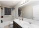 Bathroom featuring a double sink vanity and a shower-tub combo, perfect for convenience at 5217 Creekside Park Ave, Orlando, FL 32811