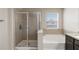 Bathroom with a separate shower and soaking tub at 5217 Creekside Park Ave, Orlando, FL 32811