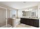 Bathroom features a double sink vanity, shower, soaking tub, and tiled floors at 5217 Creekside Park Ave, Orlando, FL 32811
