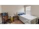 Serene bedroom with a single bed, rocking chair and soft natural light, creating a relaxing atmosphere at 5217 Creekside Park Ave, Orlando, FL 32811