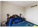 Cozy bedroom featuring a full-size bed, a window for natural light, and a closet at 5217 Creekside Park Ave, Orlando, FL 32811