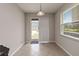 Bright dining area with tile flooring and sliding glass door to the patio at 5217 Creekside Park Ave, Orlando, FL 32811