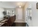 Inviting foyer showcasing tile flooring, a front door view, and an open living area with abundant natural light at 5217 Creekside Park Ave, Orlando, FL 32811