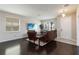 Cozy living room features hardwood floors, comfortable leather furniture, and ample natural light at 5217 Creekside Park Ave, Orlando, FL 32811