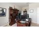 Spacious home office features built-in shelving, a large desk, and comfortable carpeting at 5217 Creekside Park Ave, Orlando, FL 32811