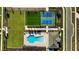 Aerial view of the pool, tennis courts, and surrounding community amenities from directly above at 5308 Citrus Leaf Blvd, Winter Garden, FL 34787