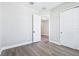 Bedroom featuring hardwood floors, white trim and doors, and a walk in closet at 5308 Citrus Leaf Blvd, Winter Garden, FL 34787