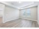 Spacious bedroom with tray ceiling, recessed lighting and modern wood-look flooring at 5308 Citrus Leaf Blvd, Winter Garden, FL 34787