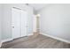 Bedroom featuring modern wood-look floors and a spacious closet at 5308 Citrus Leaf Blvd, Winter Garden, FL 34787