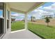 An open-air covered patio overlooks a spacious lawn and provides ample space for relaxation at 5308 Citrus Leaf Blvd, Winter Garden, FL 34787