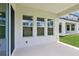Covered patio featuring three windows and showing the seamless indoor-outdoor living design at 5308 Citrus Leaf Blvd, Winter Garden, FL 34787