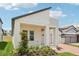 Charming single-Gathering home featuring a covered front porch, modern design and manicured landscaping at 5308 Citrus Leaf Blvd, Winter Garden, FL 34787