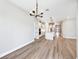 Open concept living space featuring hardwood floors and modern chandelier in a bright and airy space at 5308 Citrus Leaf Blvd, Winter Garden, FL 34787