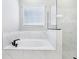Bright bathroom with a soaking tub and a large glass shower with white marble surround at 5308 Citrus Leaf Blvd, Winter Garden, FL 34787