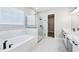 Bright main bath features a soaking tub, large shower, and a walk-in closet at 5308 Citrus Leaf Blvd, Winter Garden, FL 34787