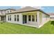 Covered patio area extending from the rear of home, ideal for relaxing and enjoying the backyard at 5308 Citrus Leaf Blvd, Winter Garden, FL 34787