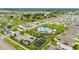 This aerial view shows the community pool, playground, and green spaces nestled within the neighborhood's layout at 622 Taft Dr, Davenport, FL 33837
