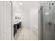 A bright bathroom features double sinks, granite countertops, and a glass enclosed shower and tub at 622 Taft Dr, Davenport, FL 33837