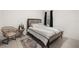 Comfortable bedroom featuring a bed, stylish rug, and a cozy chair at 622 Taft Dr, Davenport, FL 33837