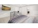 Bedroom featuring tile floors, modern television, and adjoining bathroom at 622 Taft Dr, Davenport, FL 33837
