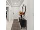 Bright foyer featuring tiled floors, a console table with decor, and a decorative mirror at 622 Taft Dr, Davenport, FL 33837