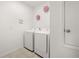 Clean laundry room with modern appliances and stylish decor at 622 Taft Dr, Davenport, FL 33837