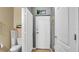 Neutral colored half bath with toilet and wall decor that adds to the cozy ambiance of the home's interior at 6462 S Goldenrod Rd # 31B, Orlando, FL 32822