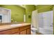 Full bathroom with tub, shower, and vanity with storage, offering a blend of style and practicality at 6462 S Goldenrod Rd # 31B, Orlando, FL 32822