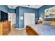 Well-lit bedroom featuring wood floors, a closet, and a glimpse into the hall at 6462 S Goldenrod Rd # 31B, Orlando, FL 32822