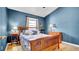 A bedroom with a vaulted ceiling, wood bed frame and furniture, and natural light at 6462 S Goldenrod Rd # 31B, Orlando, FL 32822
