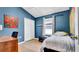 Bedroom with a double closet, vaulted ceiling, and natural light at 6462 S Goldenrod Rd # 31B, Orlando, FL 32822