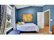 Bright bedroom features a large window offering plenty of natural light and a comfortable bed for a relaxing retreat at 6462 S Goldenrod Rd # 31B, Orlando, FL 32822