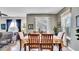 Inviting dining area with a floral tablecloth, seating for six, and natural light from a large window at 6462 S Goldenrod Rd # 31B, Orlando, FL 32822
