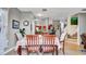 Charming dining area with seating for six, next to open-concept kitchen and stairwell at 6462 S Goldenrod Rd # 31B, Orlando, FL 32822