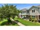 Backyard grassy area with a concrete walkway and back patio with a patio set at 6462 S Goldenrod Rd # 31B, Orlando, FL 32822