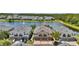 Beautiful townhome featuring two-car garage with lush landscaping and tranquil lake view at 6462 S Goldenrod Rd # 31B, Orlando, FL 32822