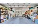 Spacious garage with laundry area, storage shelves, and ample workspace, offering versatile utility and organization at 6462 S Goldenrod Rd # 31B, Orlando, FL 32822