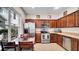 Bright kitchen with stainless steel appliances and a large window for natural light, with seating nearby at 6462 S Goldenrod Rd # 31B, Orlando, FL 32822
