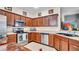 Well-equipped kitchen featuring ample cabinet space, stainless steel appliances, and durable countertops at 6462 S Goldenrod Rd # 31B, Orlando, FL 32822