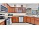 Well-equipped kitchen featuring ample cabinet space, stainless steel appliances, and durable countertops at 6462 S Goldenrod Rd # 31B, Orlando, FL 32822