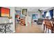 Living area with staircase, artwork, comfortable seating, and adjacent dining space at 6462 S Goldenrod Rd # 31B, Orlando, FL 32822