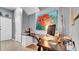 Bright office with artwork, a large desk, computer setup, and a door to enhance productivity at 6462 S Goldenrod Rd # 31B, Orlando, FL 32822