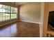 Comfortable bedroom with hardwood floors and a large window offering plenty of natural light for a peaceful retreat at 6610 Pampus Dr, Orlando, FL 32819