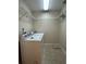 Functional laundry room with washer, dryer, and wire shelving at 6610 Pampus Dr, Orlando, FL 32819