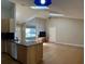 Open concept living room and kitchen area with wood floors and vaulted ceilings at 6610 Pampus Dr, Orlando, FL 32819