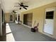 Spacious screened patio with ceiling fans, offering an ideal spot for outdoor relaxation and entertainment at 6610 Pampus Dr, Orlando, FL 32819